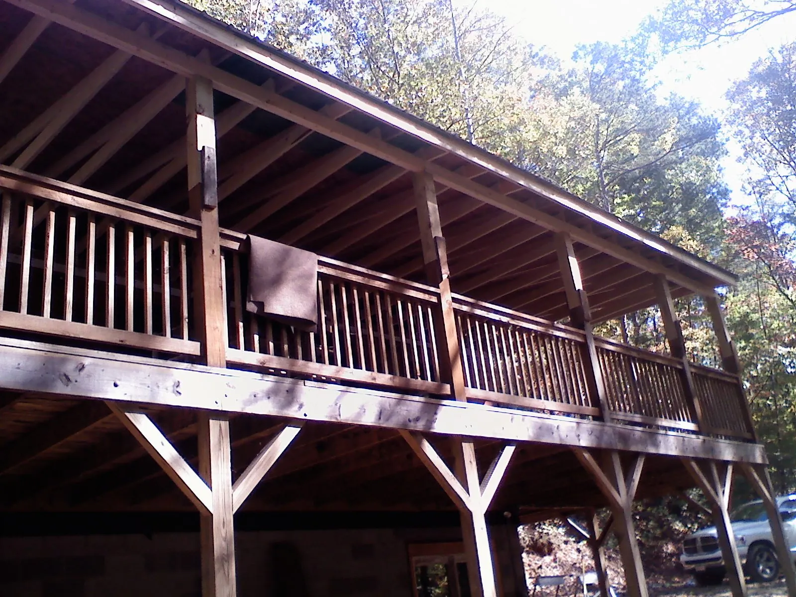 Timber framing under a new elevated porch and deck — Roof Leak Repair in East Smithfield by Roofing Brothers